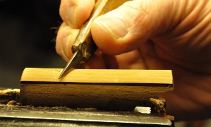 correction of the top surface by scraping with a knife
