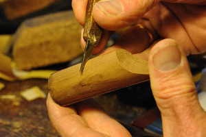 scraping wood from underneath the block